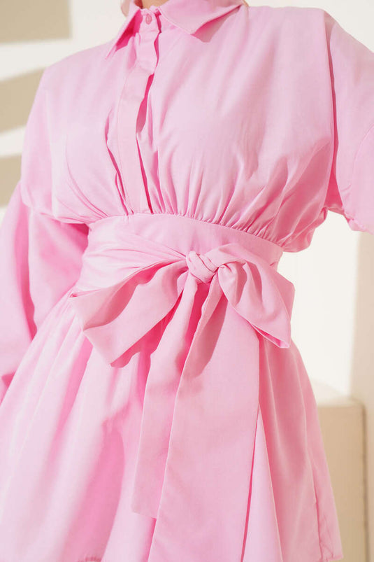 Tunique rose avec ceinture assortie et devant froncé