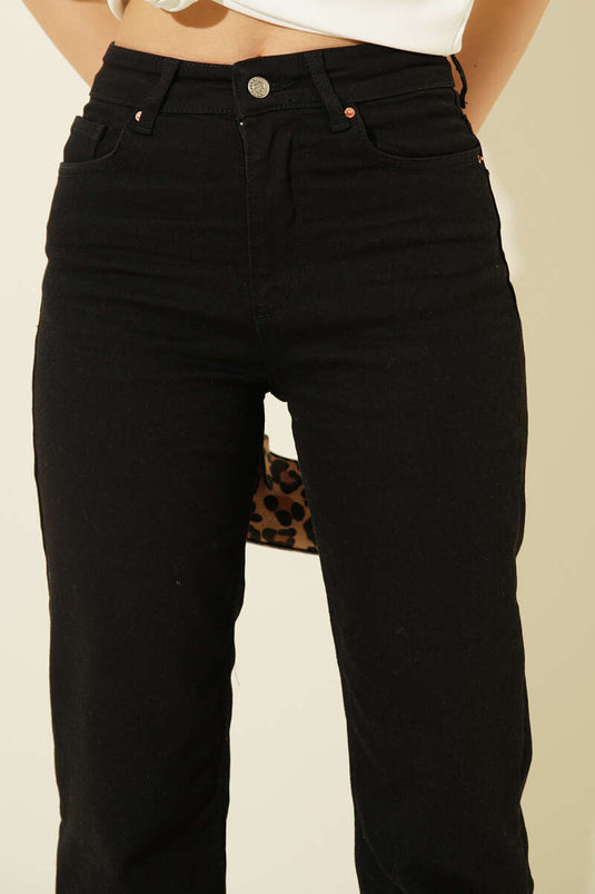 Pantalon en jean noir à jambe étroite avec boutons