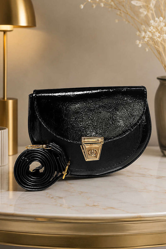 Sac ovale en cuir verni avec détail de fermeture, noir
