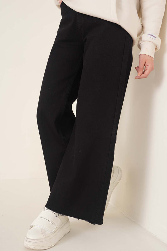 Kurze Jeanshose mit Quasten in Schwarz