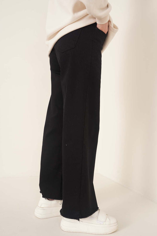 Kurze Jeanshose mit Quasten in Schwarz