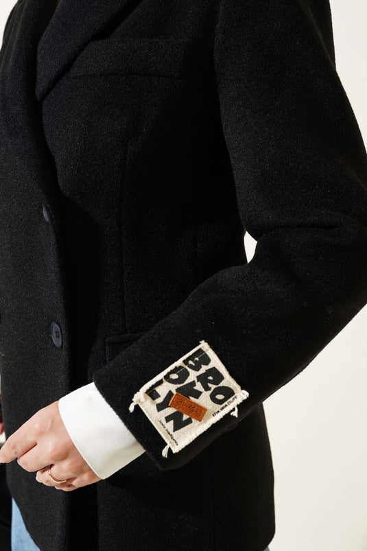 Manteau estampé avec broderie à manches noir