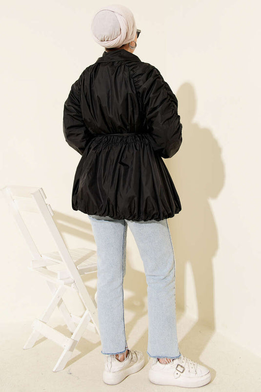 Trench-coat noir à fermeture éclair et manches froncées