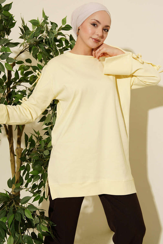 تونيك أصفر بتفاصيل فيونكة على الأكمام