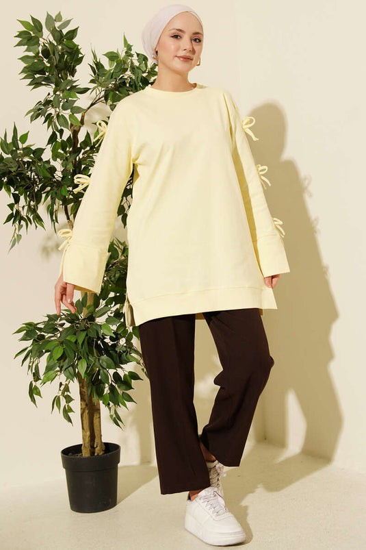 تونيك أصفر بتفاصيل فيونكة على الأكمام