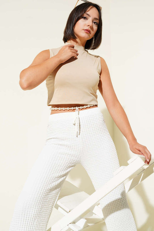 Body senza maniche con collo alto beige