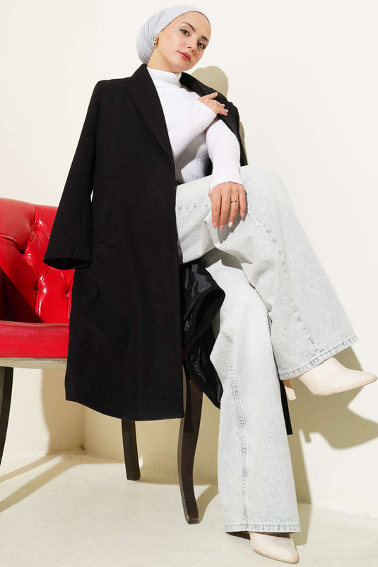 Manteau en cachemire noir à double boutonnage et poches