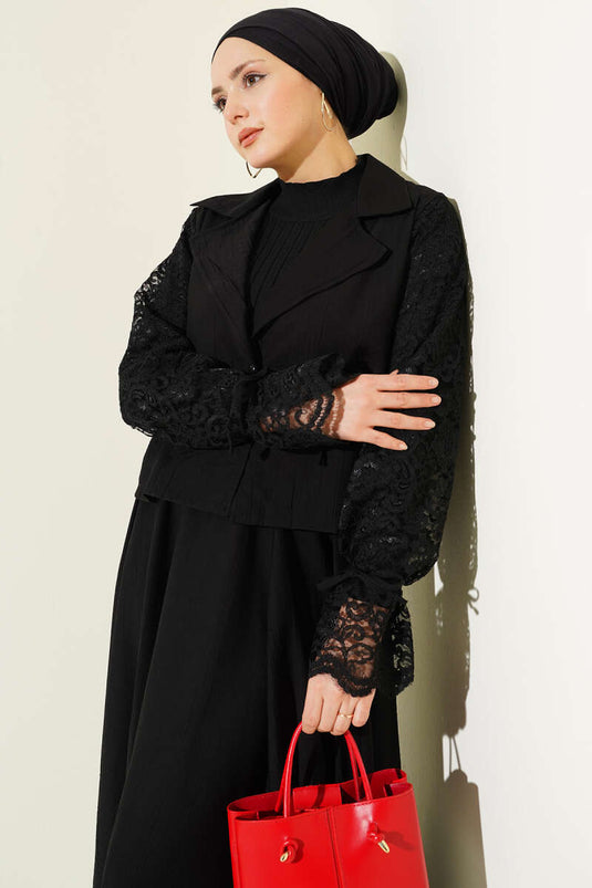 Ensemble deux pièces noir avec jupe à dentelle et col croisé