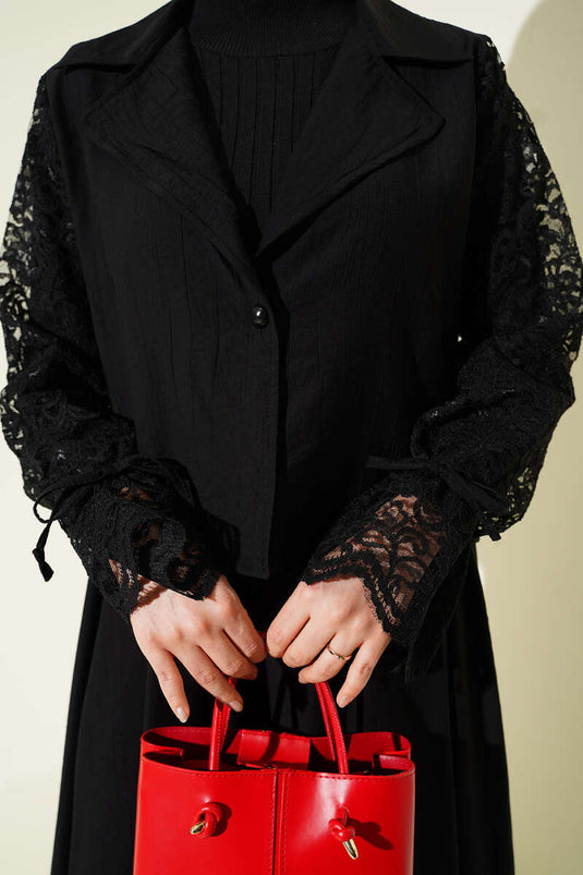 Ensemble deux pièces noir avec jupe à dentelle et col croisé