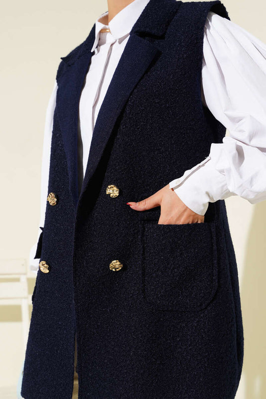 Gilet bleu marine à double boutonnage et col croisé.