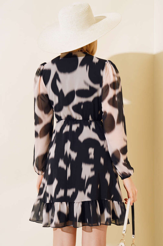 Vestido cruzado de tul negro de manga larga