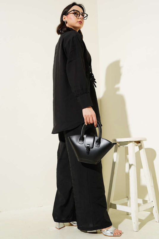 طقم تونيك مكون من قطعتين بتفاصيل فتحات باللون الأسود