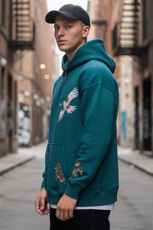 Herentrui met kap en vogelborduursel, petrolkleurig