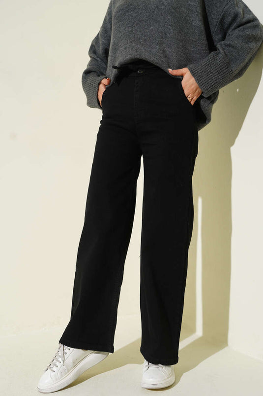 Pantalon en jean noir à taille élastiquée avec ceinture