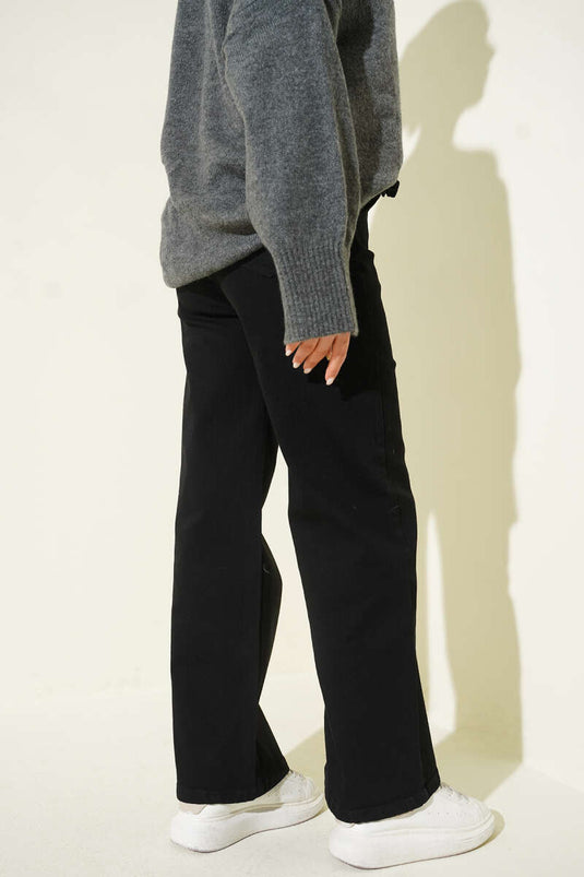 Pantalon en jean noir à taille élastiquée avec ceinture
