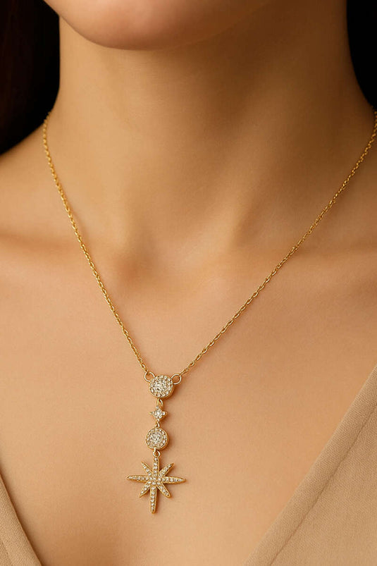 Gouden halsketting met Poolster en stenen