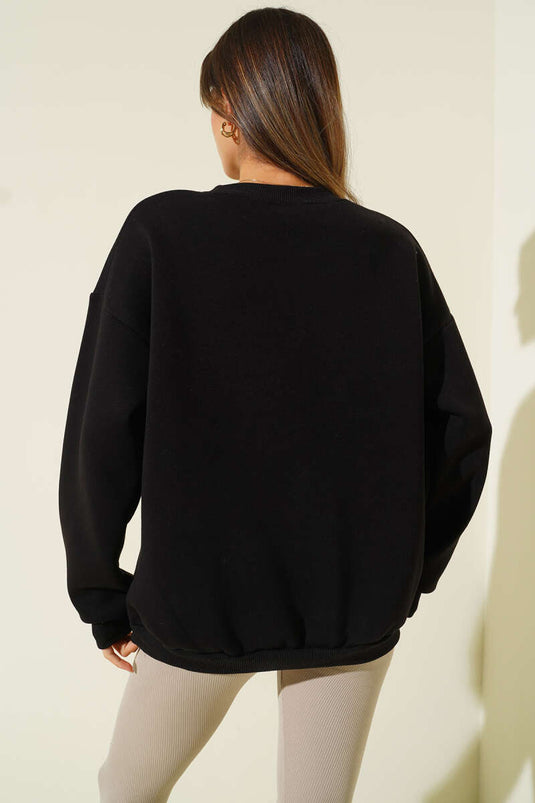 سويت شيرت أسود من الصوف المطرز بنقشة جلد النمر