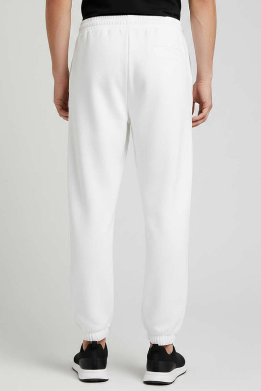 بنطال رياضي رجالي بكاحل مطاطي لون عاجي