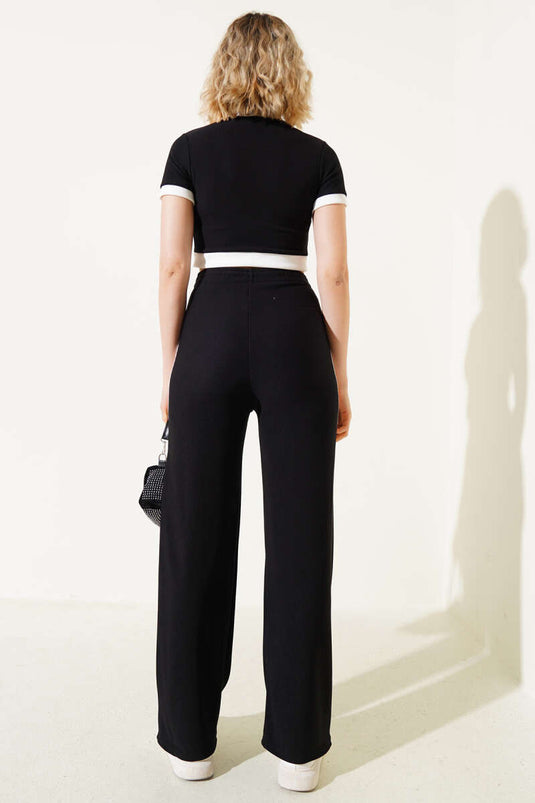 Ensemble deux pièces noir : débardeur court à manches courtes et boutons métalliques