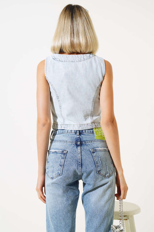 Gilet en jean bleu glacier à boutons métalliques