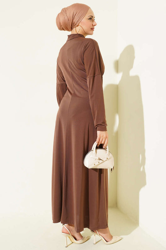 Coffee-colored ruched dress with metal buckle.