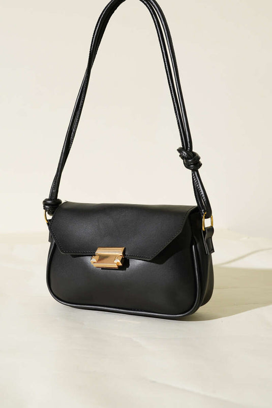 حقيبة سوداء بمقبض مزدوج وإغلاق مغناطيسي