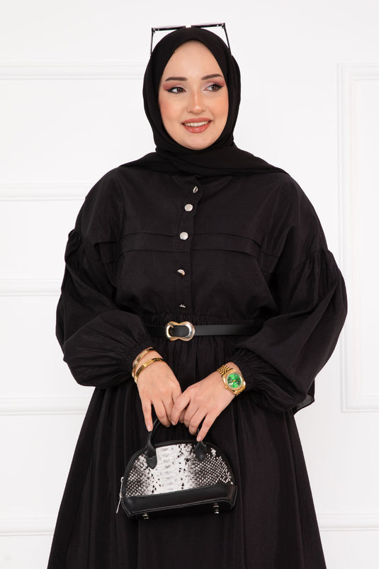 بدلة حجاب سوداء ذات تنورة مضلعة وتفاصيل
