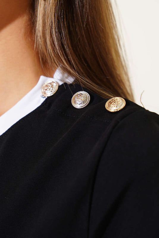 بلوزة بأزرار على الكتف باللون الأسود