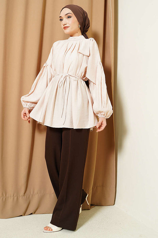 Tunique ample beige avec nœud à l'épaule