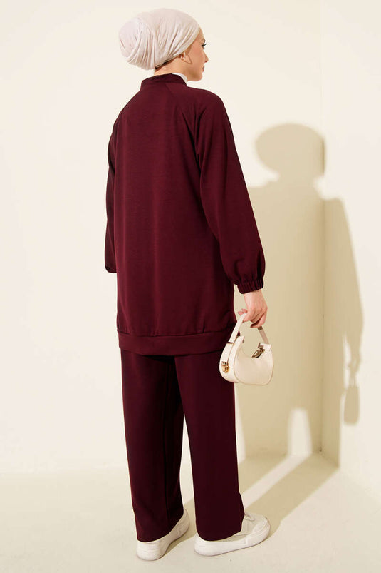 Set doppio con zip e pietre sulle spalle, colore bordeaux