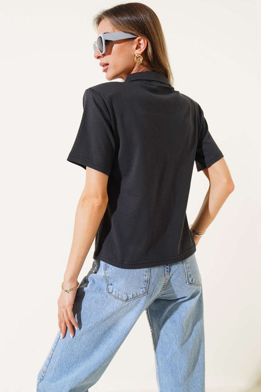 T-shirt noir à fermeture éclair avec épaulettes