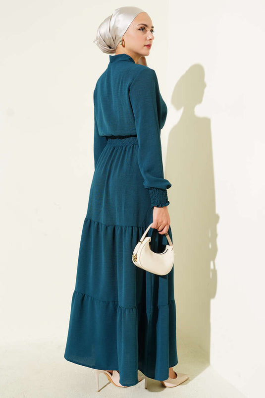 Jurk met strikdetail aan de voorkant en elastische tailleband, petrolgroen