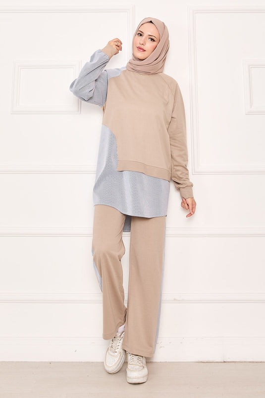 Costume deux pièces avec garniture de ligne asymétrique sur le devant, beige