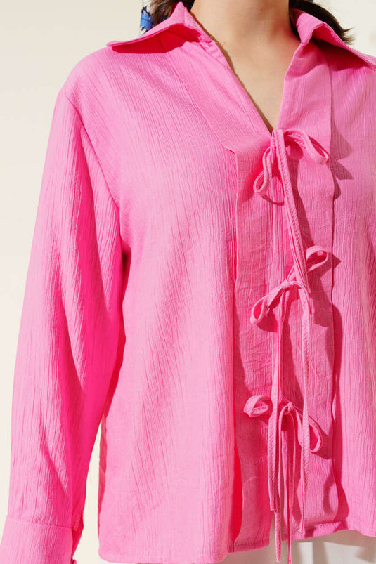 Roze blouse met kanten details aan de voorkant