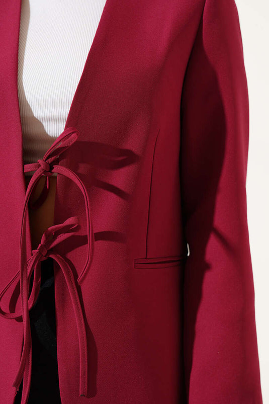 Veste doublée bordeaux à nouer sur le devant