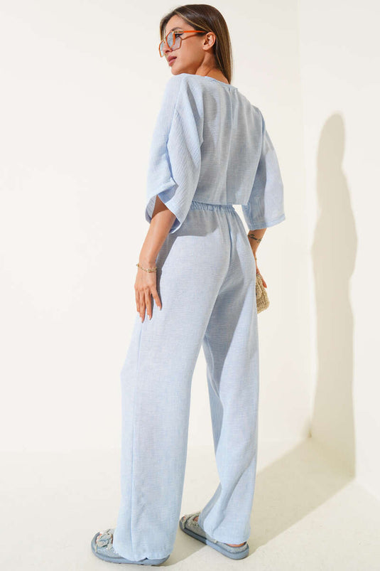 Tweedelig pak met strik aan de voorkant, blauw