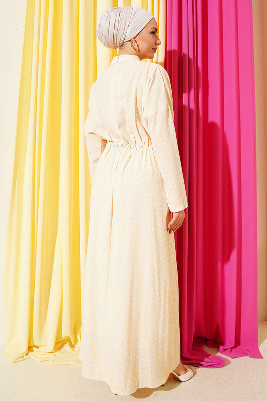 Robe à pois avec détail froncé devant jaune