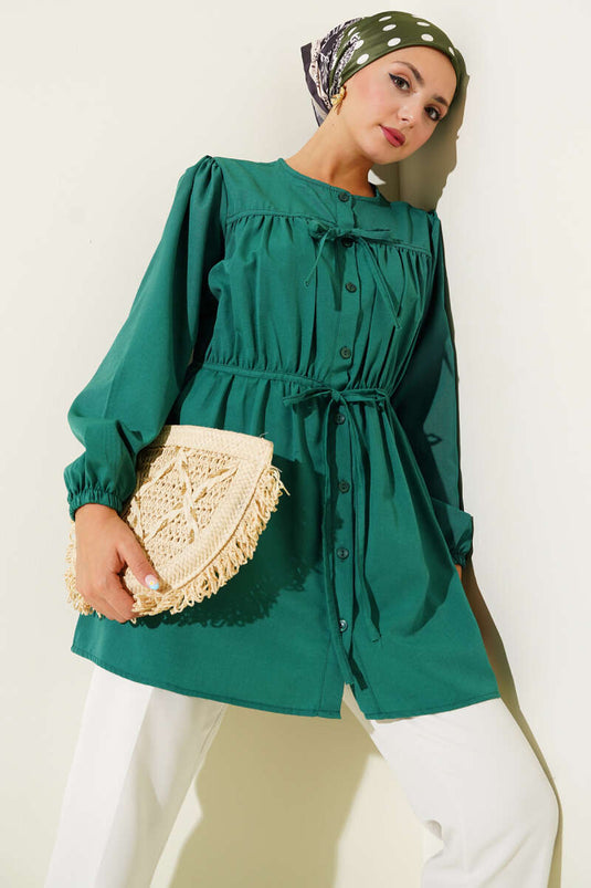 Groen shirt met trekkoord en kant aan de voorkant