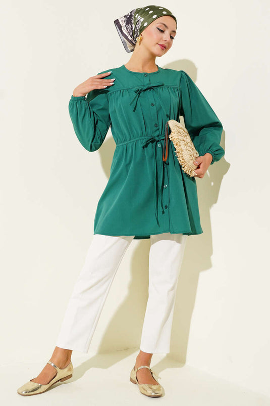 Groen shirt met trekkoord en kant aan de voorkant