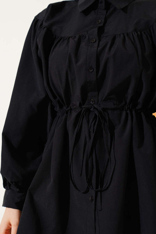 Chemise noire à ceinture froncée et tunnel à la taille