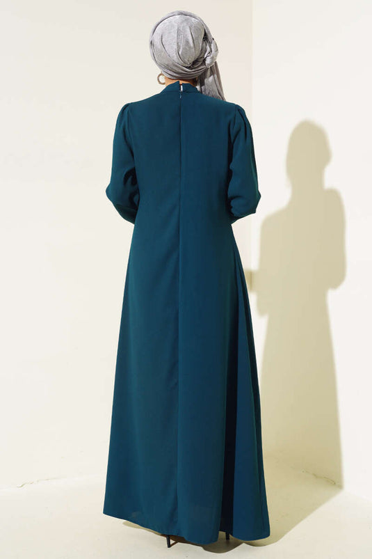 Abito con fiore in pietra sul davanti Petrolio