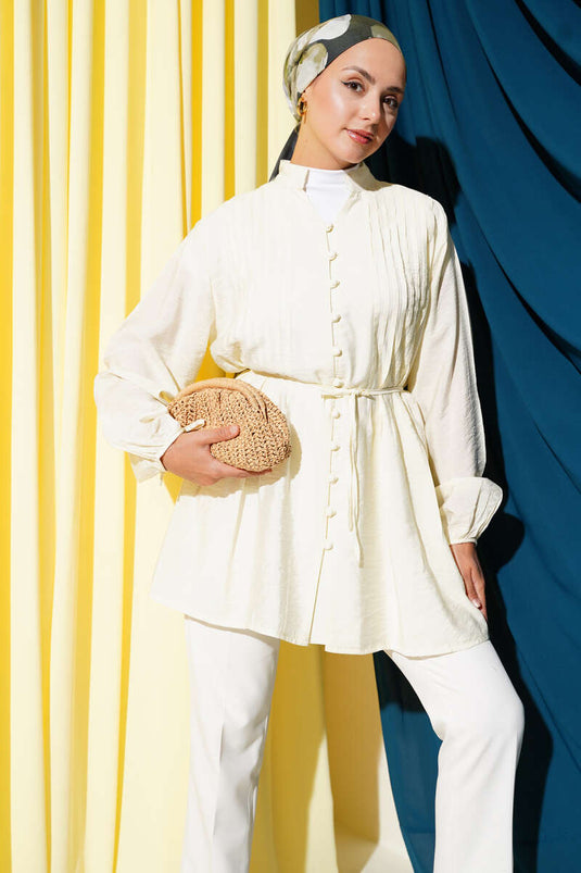 قميص أصفر مطوي بأزرار أمامية