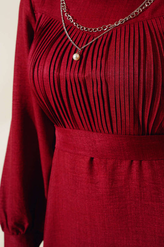 فستان من الكتان بكسرات أمامية باللون العنابي