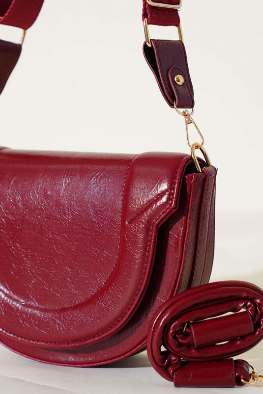 Sac ovale bordeaux à détails de surpiqûres