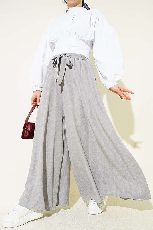 Pantaloni oversize con risvolto e cintura grigi