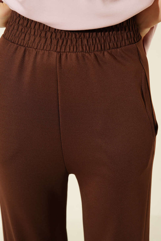 Pantalon en scuba à jambes fuselées avec ceinture élastique marron