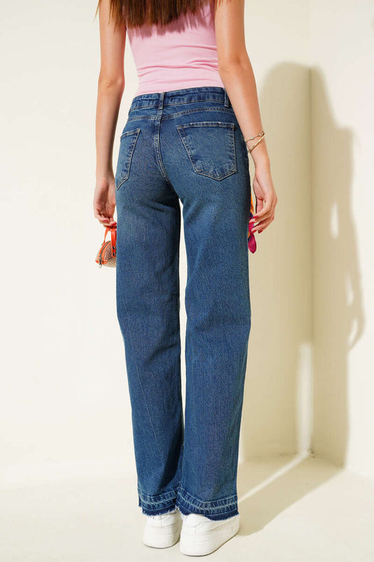 Vaqueros de mezclilla con detalle de borlas en el dobladillo, azul