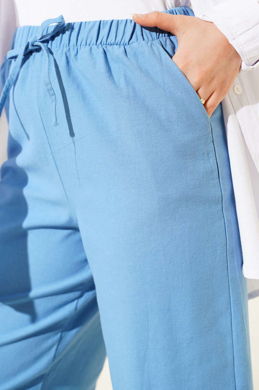 بنطلون مزين بالشراشيب والدانتيل باللون الأزرق