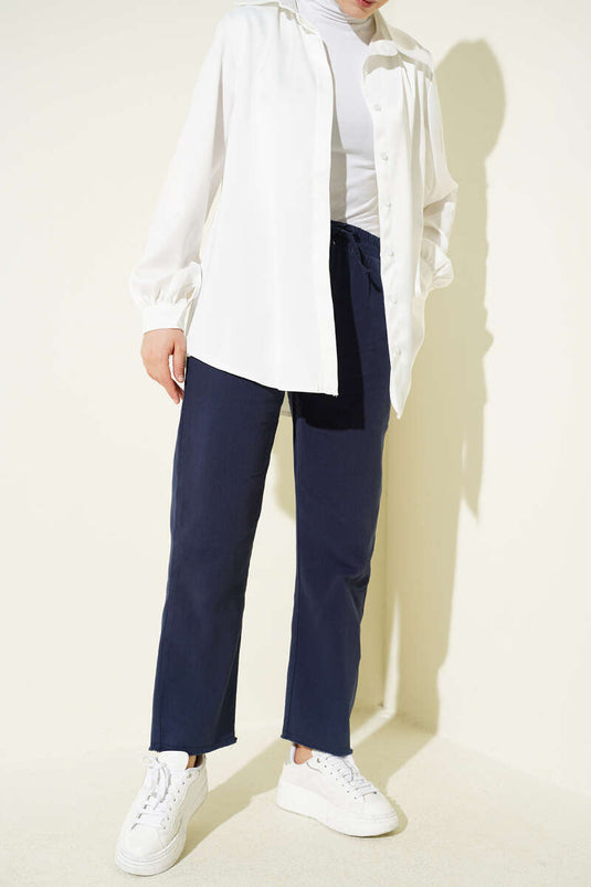 Pantalon en gabardine bleu marine avec taille élastique et franges