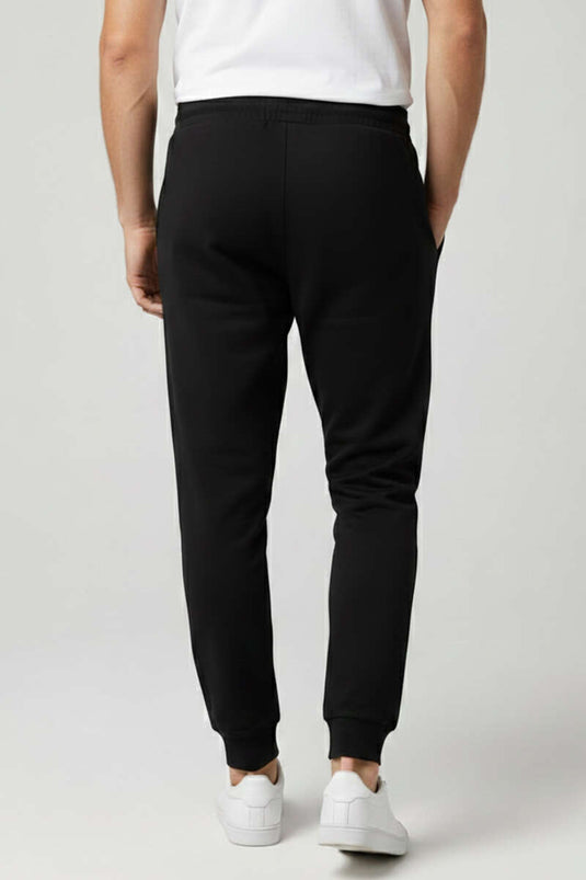 Pantalon de survêtement pour homme avec poches et bord-côte aux chevilles, noir